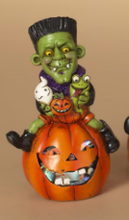 Load image into Gallery viewer, LIGHTED HALLOWEEN FIGURINE SITTING ON PUMPKIN
