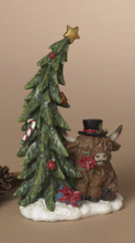 Load image into Gallery viewer, HIGHLAND COW SITTING BY TREE FIGURE
