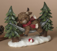 Load image into Gallery viewer, HOLIDAY HIGHLAND COW IN HAMMOCK FIGURINE
