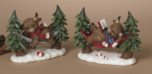 Load image into Gallery viewer, HOLIDAY HIGHLAND COW IN HAMMOCK FIGURINE
