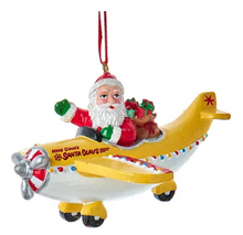 Load image into Gallery viewer, SANTA WAVING FROM AN AIRPLANE
