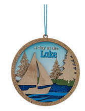 Load image into Gallery viewer, WOODEN LASER CUT LAKE BOAT &amp; HOUSE ORNAMENT
